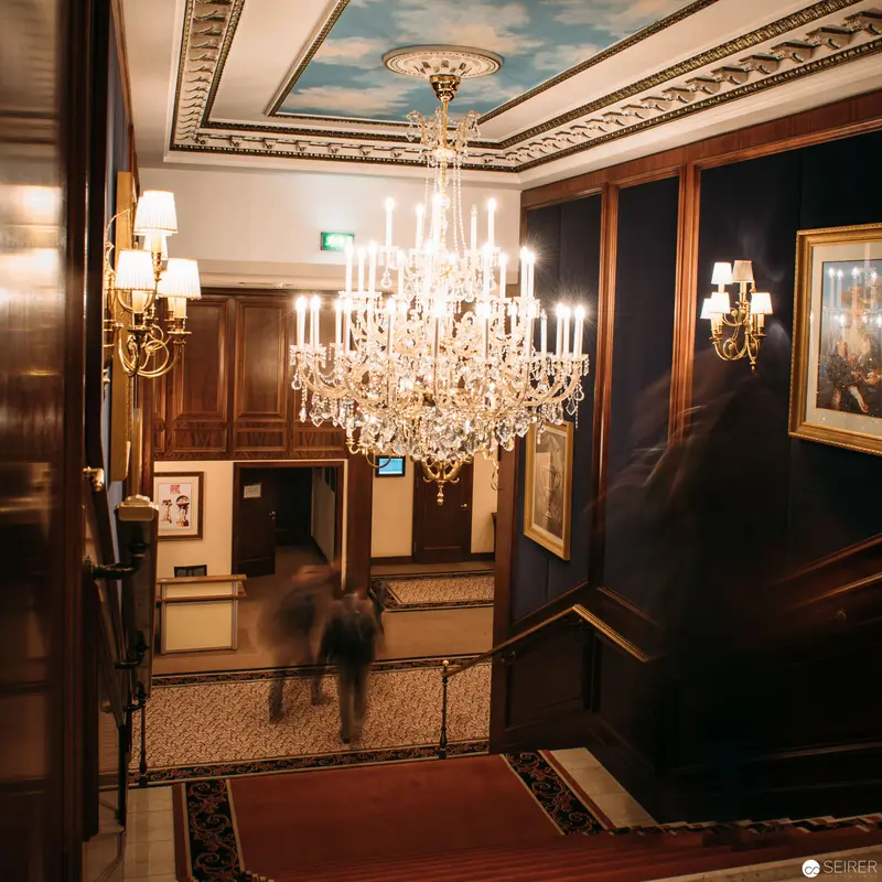 Ornate Hotel Intercontinental Lobby with Crystal Chandelier and Blurred Figures
