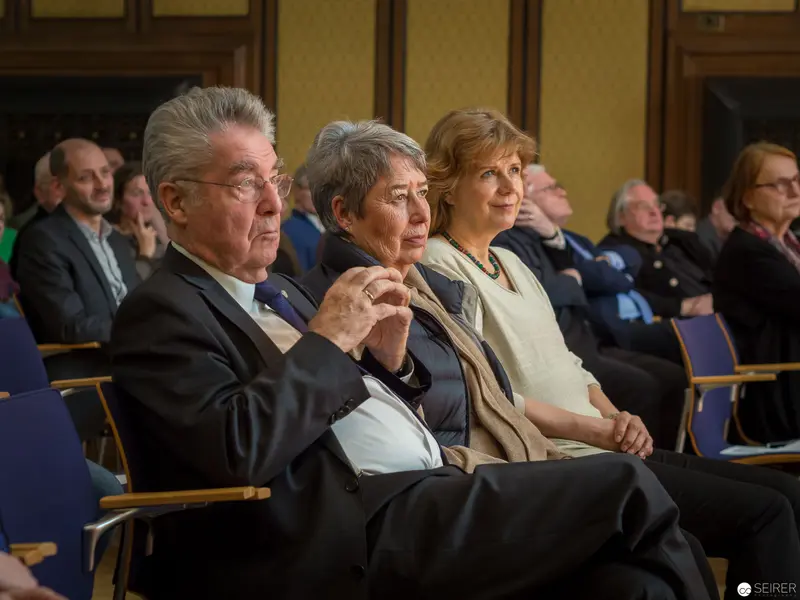 Senior Officials Seated in Formal Presentation Attending Official Governmental Proceedings