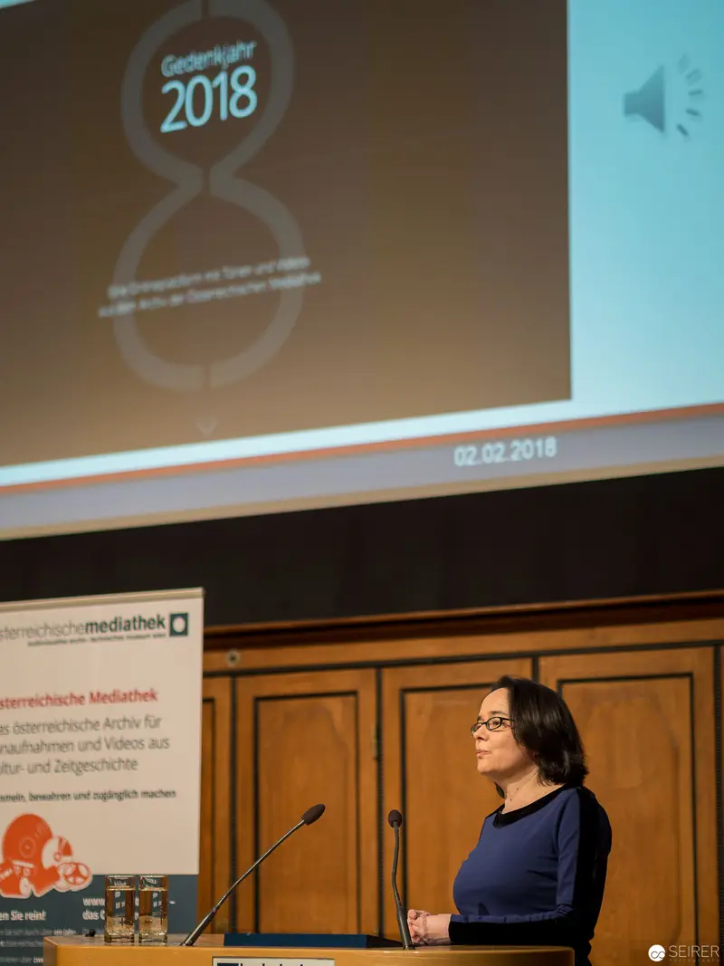 Presenter at 2018 Conference Delivering Lecture in Paneled Room
