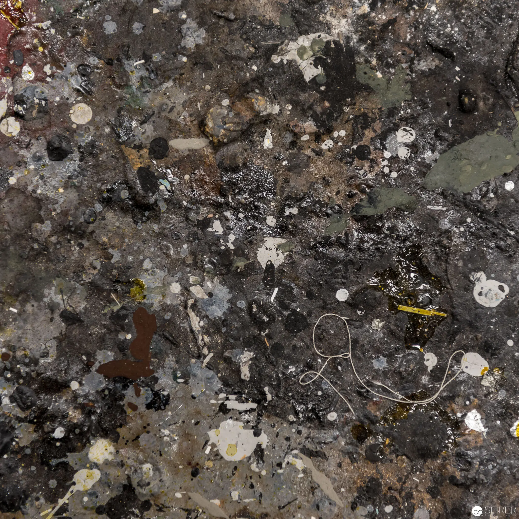 Microscopic Geological Texture with Scattered Particulate and Organic Fragments