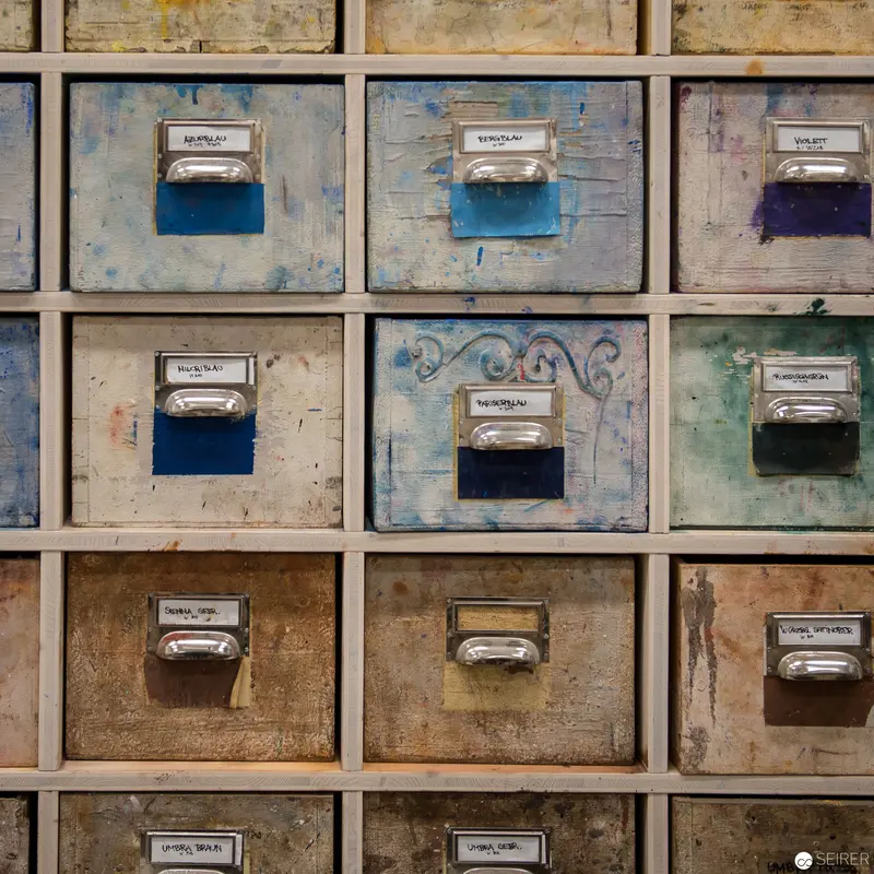 Weathered Archive Drawers: Vintage Storage System with Patinated Metal Labels