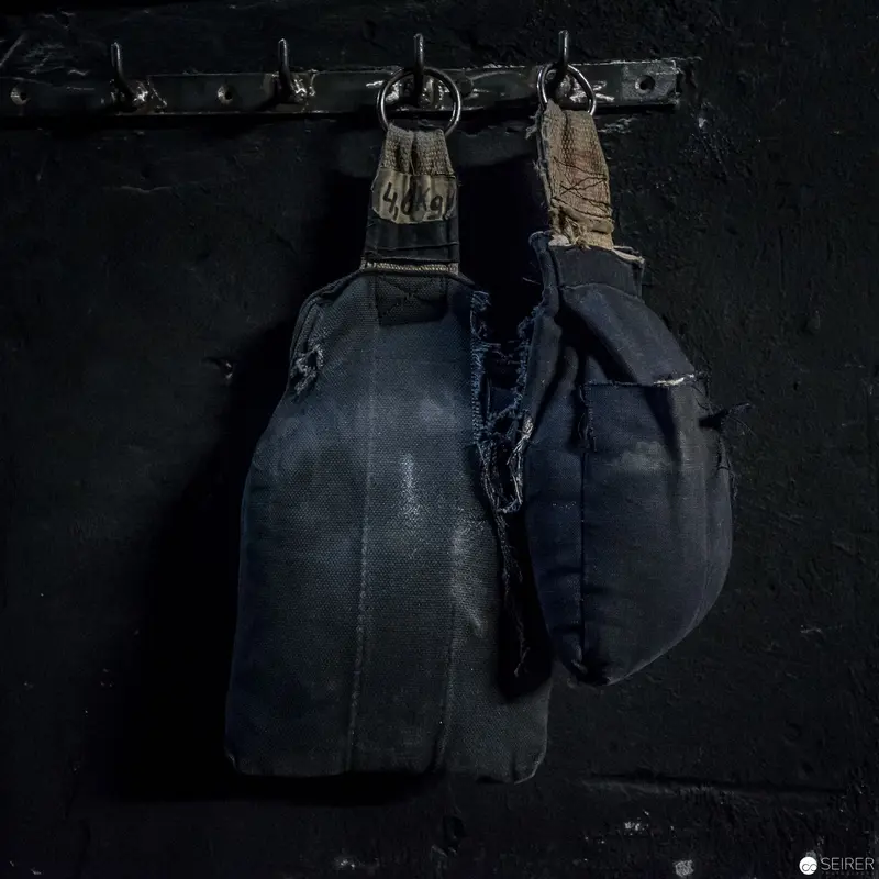 Dark Study of Worn Tactical Bags Suspended in Monochromatic Space