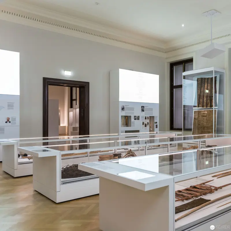 Museum Display of Archaeological Artifacts in Minimalist White Gallery Space