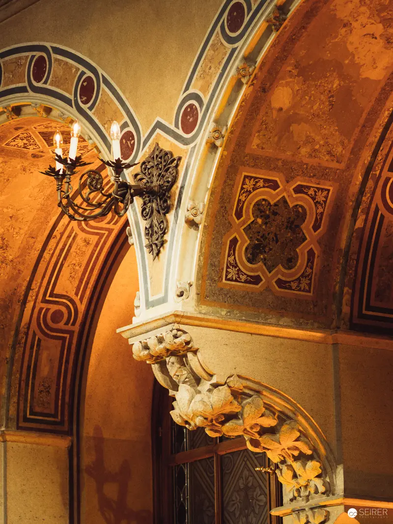 Ornate Architectural Detail with Baroque Archway and Decorative Wall Sculpture