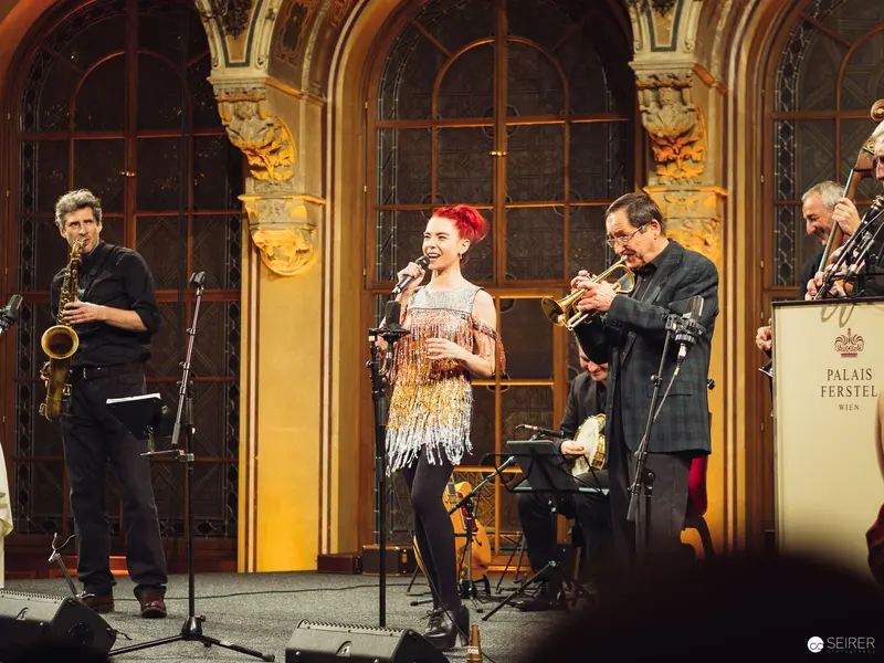 Jazz Performance at Palais Ferstel, Vienna: Vocalist and Ensemble on Ornate Stage