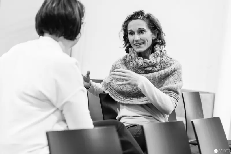 Melanie Laibl in Engaged Conversation during Interview Session