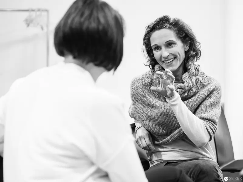 Melanie Laibl in Animated Conversation During Interview Session