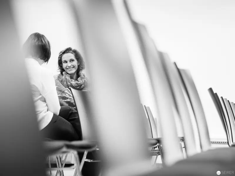 Melanie Laibl in Contemplative Conversation during Interview Session