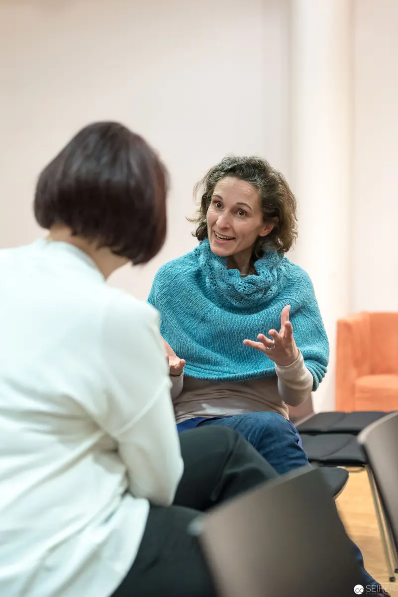 Two Women in Conversation during Professional Consultation or Meeting