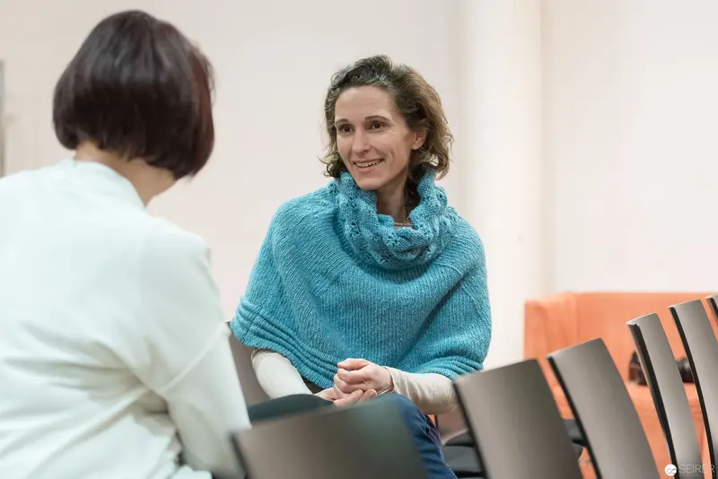 Two Women in Conversation During Professional Consultation or Meeting