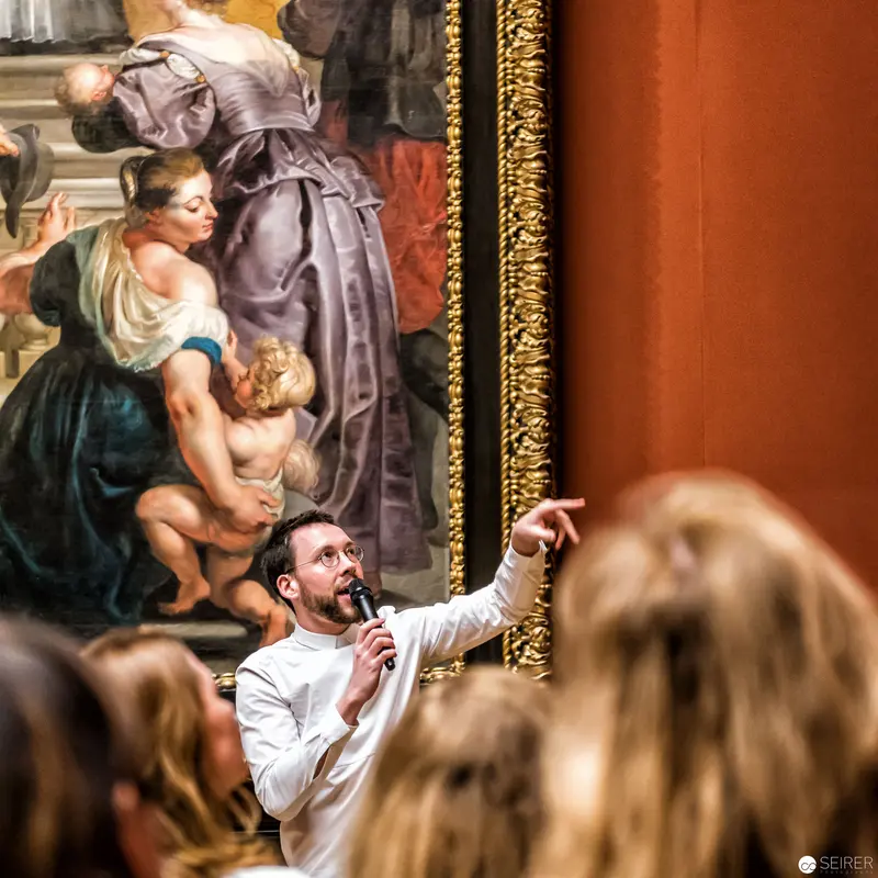 Curator Gesturing During Kunstschatzi Event at Kunsthistorisches Museum Wien