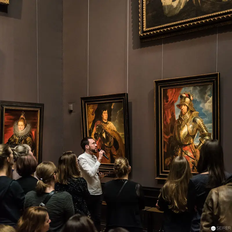 Kunstschatzi Event at KHM: Visitors Engage with Baroque Portraiture in Dramatic Gallery Setting