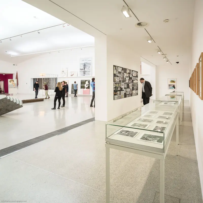Optik Schröder II Exhibition View at MUMOK with Visitors Examining Photographic Displays