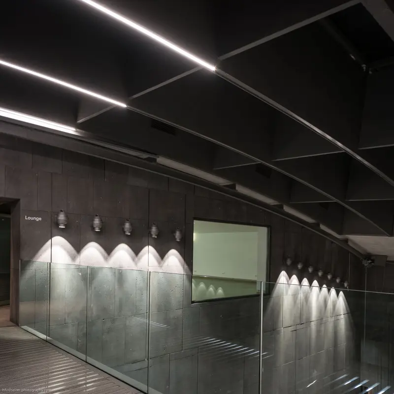 Illuminated Glass Partitions in Minimalist Interior at MUMOK, Vienna