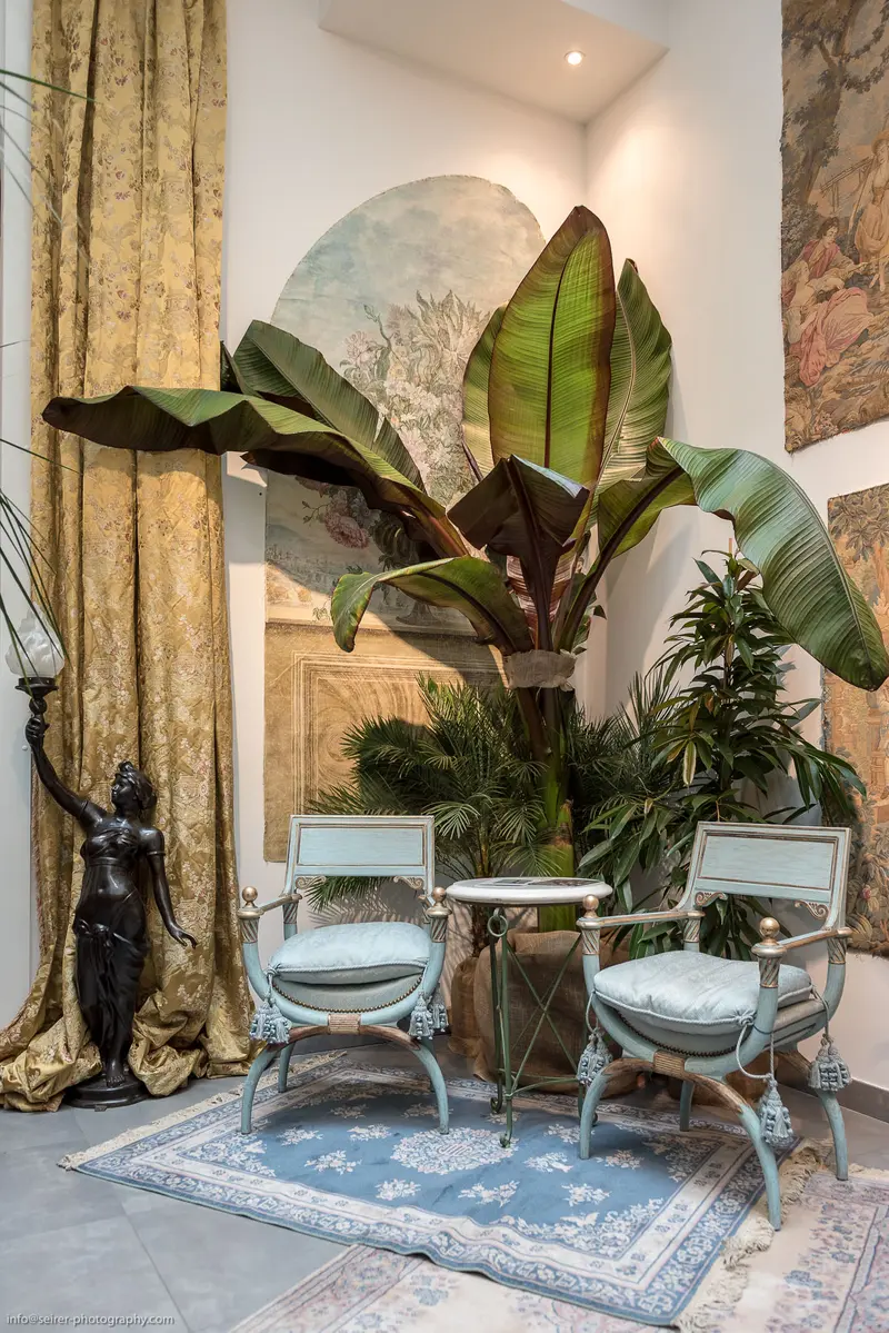 Elegant Interior with Botanical Elements and Rococo-Style Seating Arrangement