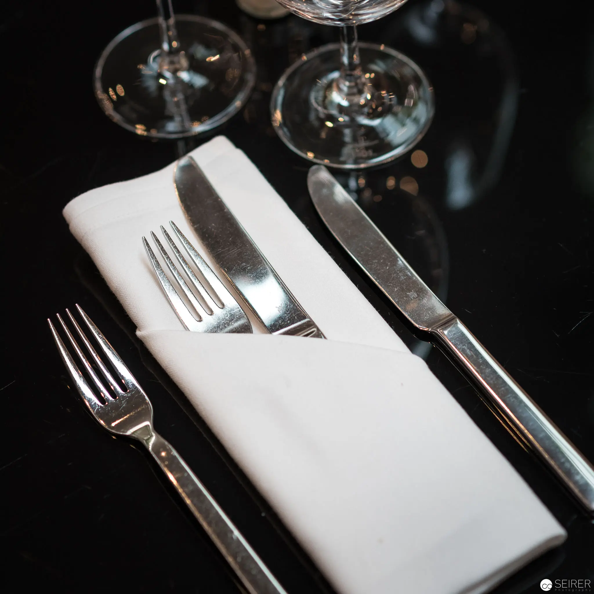 Fine Dining Table Setting with Silverware and Crystal Stemware