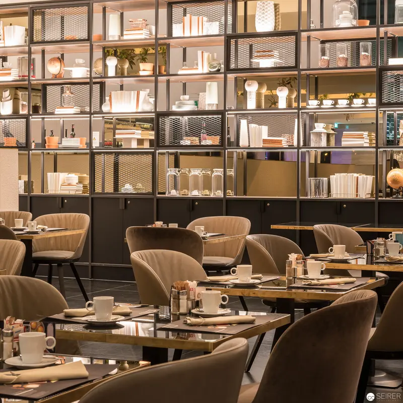 Contemporary Café Interior with Industrial-Style Shelving and Minimalist Design