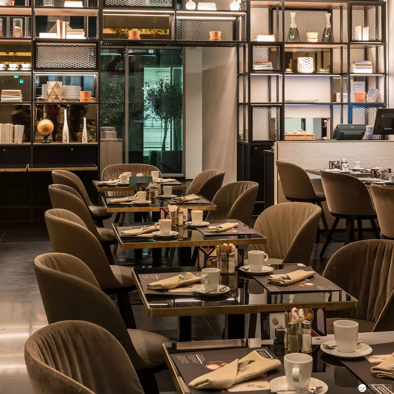 Contemporary Urban Dining Interior with Elegant Modernist Shelving and Seating