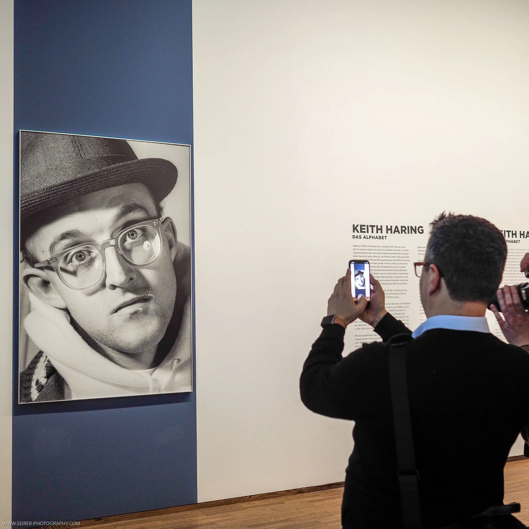 Keith Haring Exhibition: Visitor Photographs Large-Scale Portrait in Gallery Setting