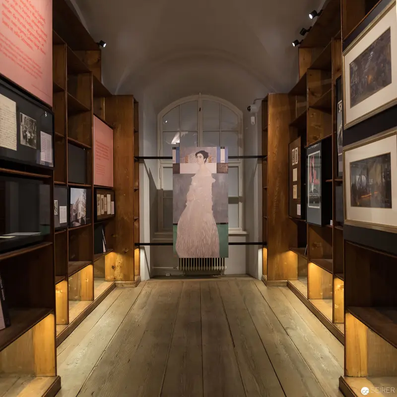 Museum Exhibition Gallery Displaying Historical Photographic Artifacts and Period Costume