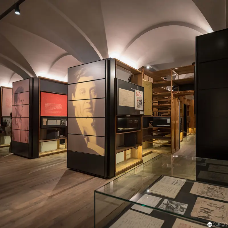 Museum Exhibition Displaying Historical Documents and Archival Materials