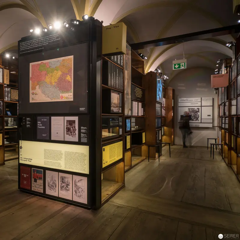 Museum Exhibition Display Exploring Historical Cartography and Archival Documentation