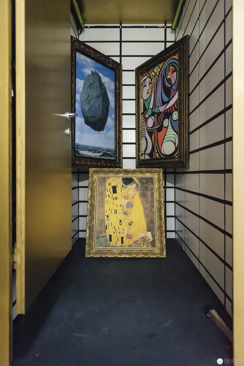 Curatorial Juxtaposition: Three Iconic Art Pieces in Intimate Gallery Corridor