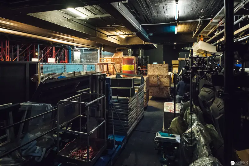 Backstage Storage and Equipment in Industrial Warehouse Setting