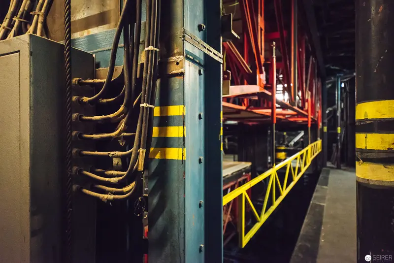 Industrial Machinery Interior with Cables and Yellow Safety Markings