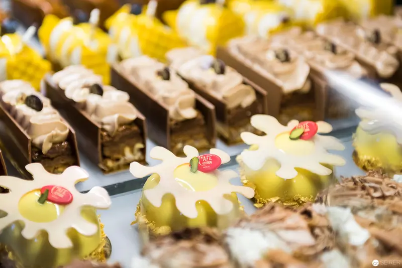 Artisanal Patisserie Display of Delicate Floral and Chocolate Desserts