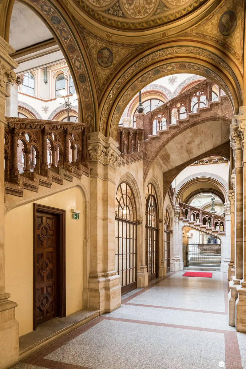 Ornate Interior of Historic Architectural Hallway with Baroque Arched Corridors