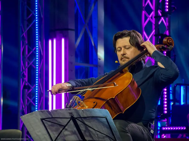 Cellist Performing with Intense Emotion at 4GameChangers Festival Stage