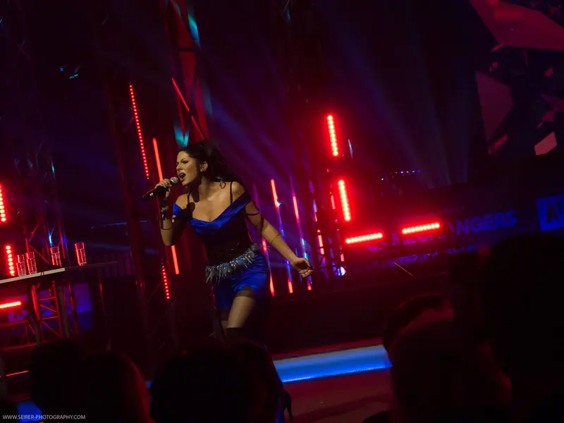 Performer on Stage at 4GameChangers Festival with Dynamic Red Lighting