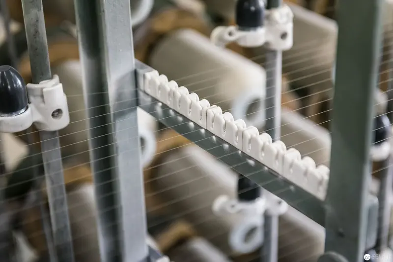 Industrial Textile Machinery Closeup with Intricate Threaded Mechanical Components