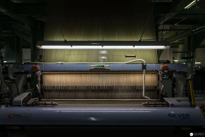 Silver Loom Weaving Machine in Industrial Textile Manufacturing Facility