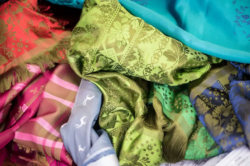 Layered Textile Study: Vibrant Silk Fabrics in Intricate Floral Patterns