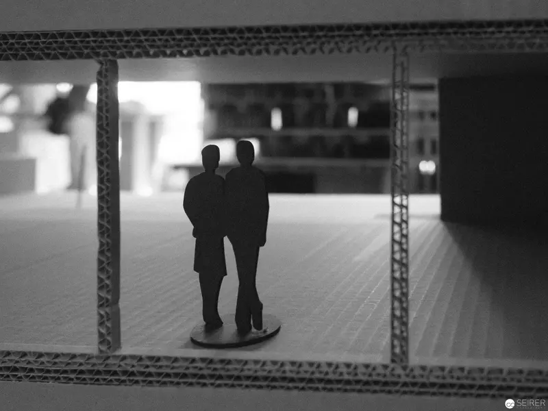 Miniature Silhouettes Framed in Architectural Model Landscape