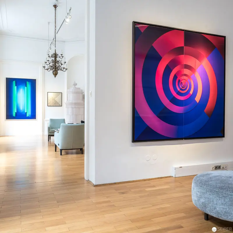 Contemporary Art Gallery Interior with Spiral Abstract Painting and Blue Light Installation