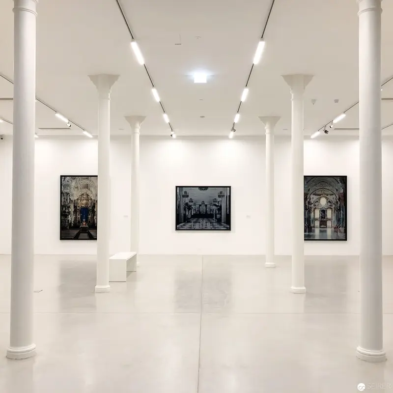 Architectural Interior Gallery Exhibition with Monochromatic Photographic Architectural Scenes