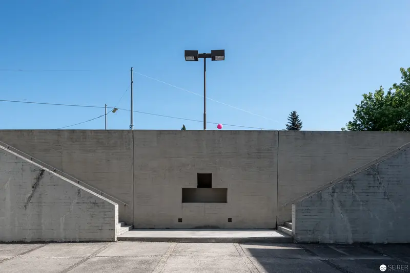 Concrete Architectural Study: Minimalist Geometric Composition with Modernist Lighting Fixture