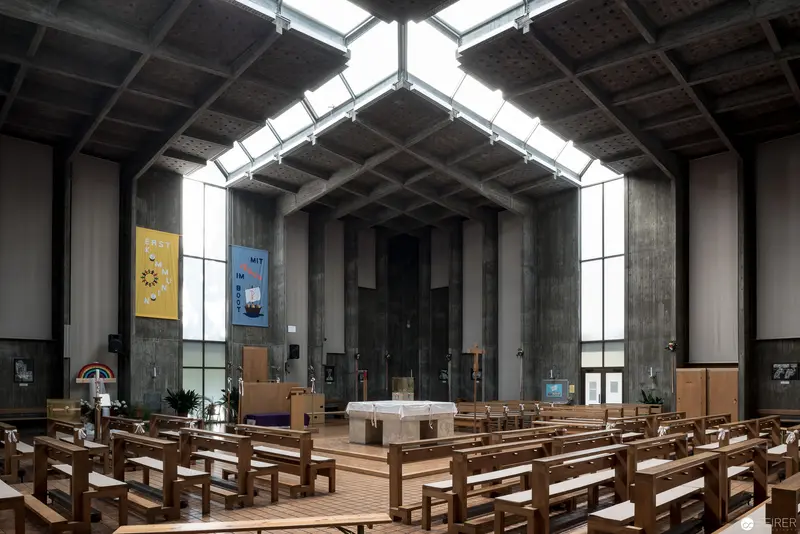 Interior of Modernist Church Architecture with Geometric Skylights and Wooden Pews