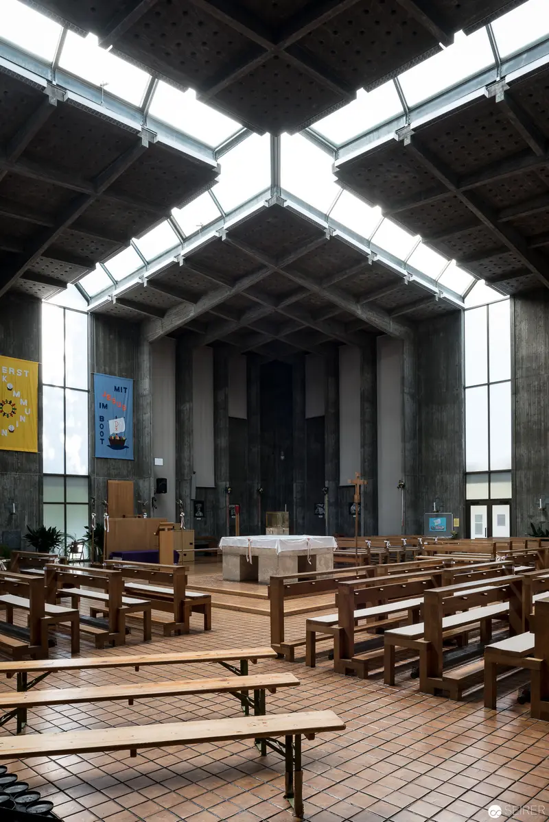 Modernist Church Interior at Pfarre Oberbaumgarten with Geometric Skylight Design