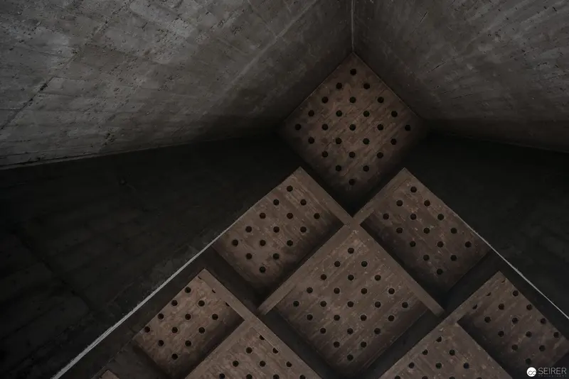Geometric Concrete Interior with Perforated Acoustic Panels in Angular Space
