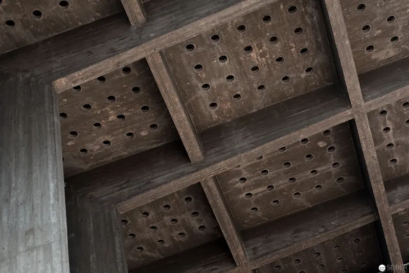 Perforated Wooden Architectural Grid: Structural Details in Monochromatic Geometry