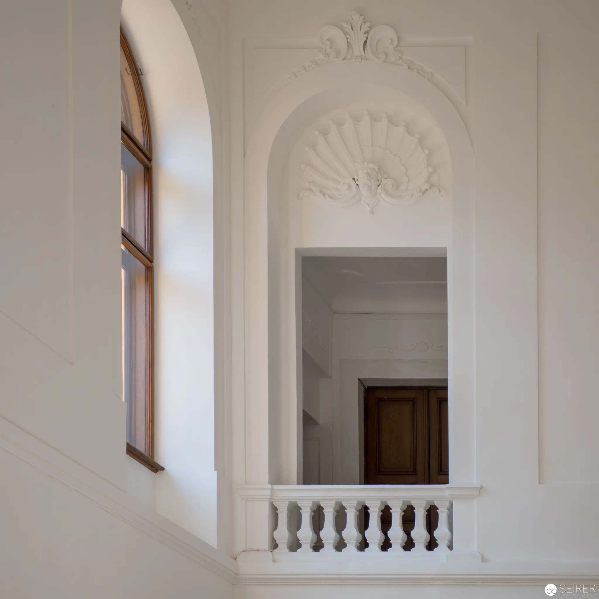Architectural Interior with Arched Window and Ornate Balustrade at Schloss Eckartsau