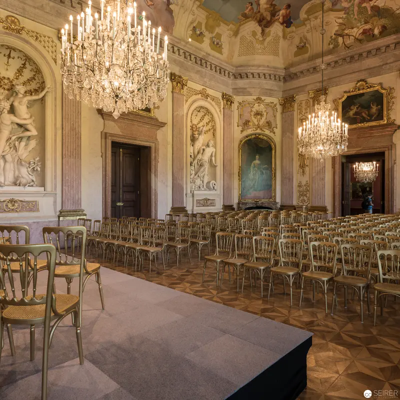 Baroque Hall in Schloss Eckartsau: Ornate Interior with Crystal Chandeliers and Gilded Chairs