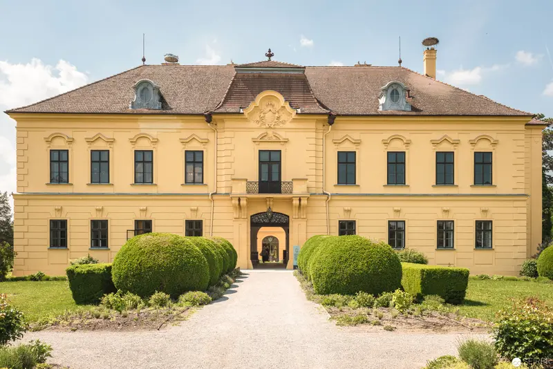 Baroque Yellow Manor House with Symmetrical Topiary Gardens in Central Europe