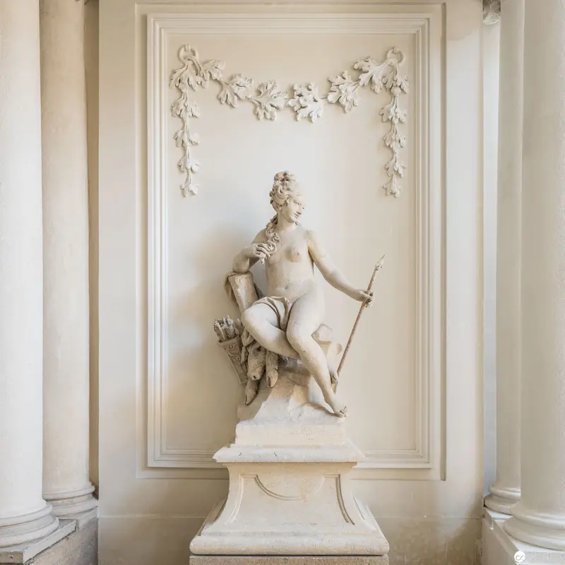 Neoclassical Marble Sculpture of Diana the Huntress in Architectural Setting