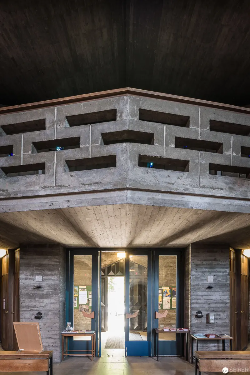 Geometric Concrete Interior of Pfarre zum guten Hirten with Architectural Lighting and Entrance