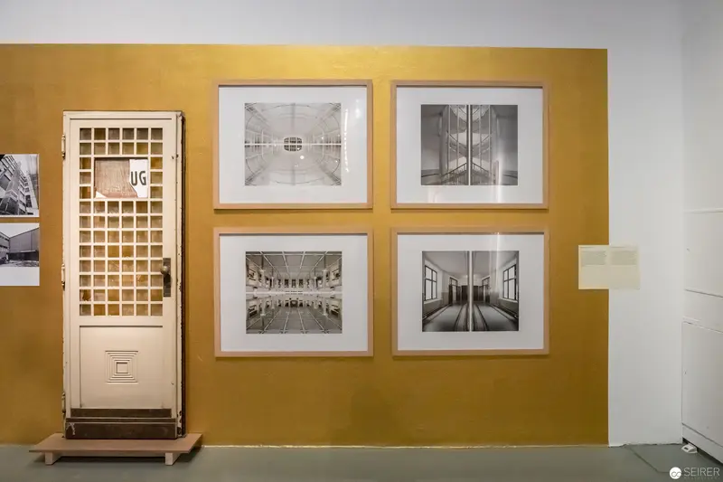Post Otto Wagner Exhibition: Architectural Photographs on Mustard-Colored Wall with Vintage Door